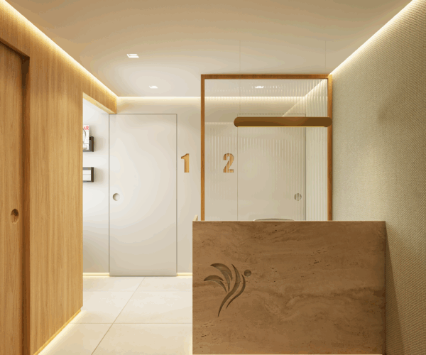 recepção de consultório médico com projeto de arquitetura contemporâneo e balcão em pedra natural iluminado.